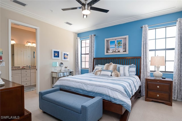 bedroom with visible vents, light carpet, and ornamental molding