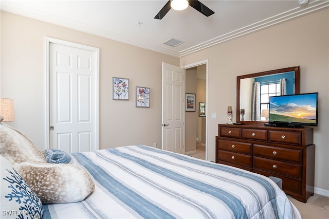bedroom with ceiling fan, light colored carpet, baseboards, visible vents, and ornamental molding