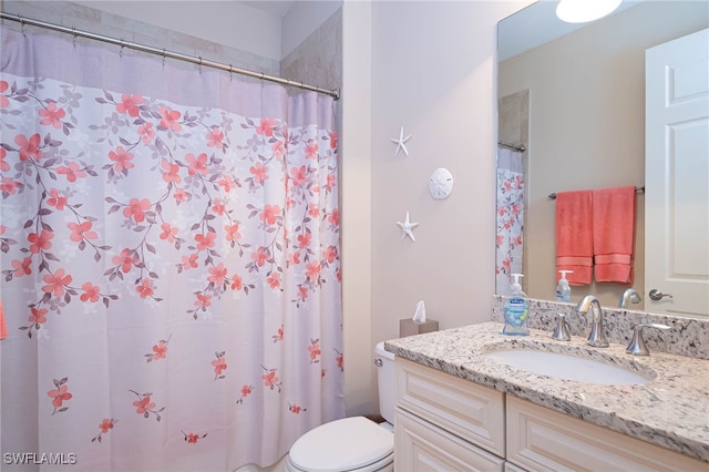 full bath featuring toilet, a shower with shower curtain, and vanity