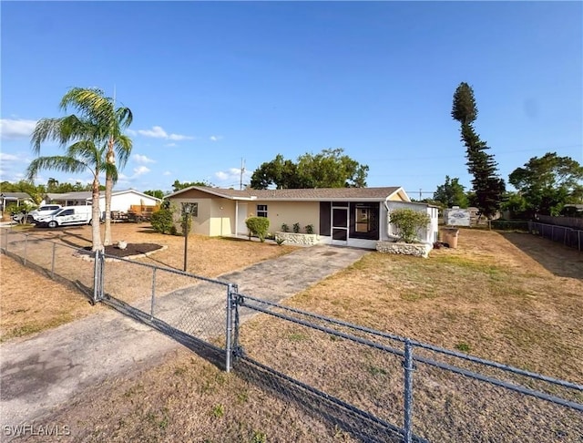 508 Wyoming Rd, Lehigh Acres, FL 33936 - ranch-style home featuring a gate, stucco siding, and driveway