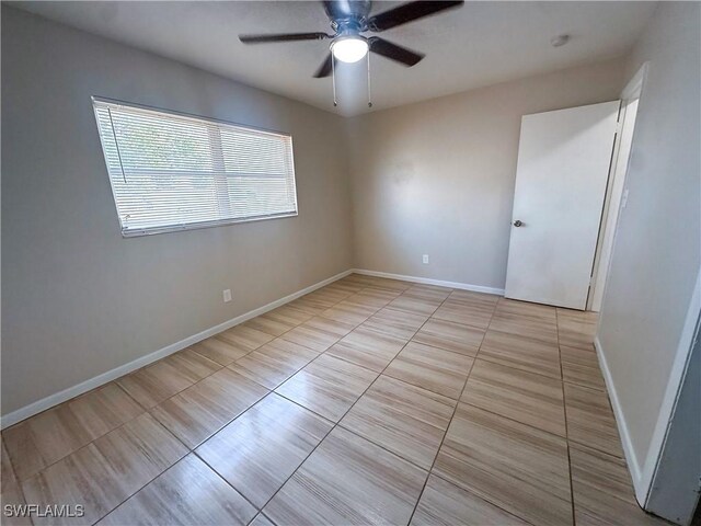 508 Wyoming Rd, Lehigh Acres, FL 33936 - unfurnished room with ceiling fan, light tile patterned floors, and baseboards