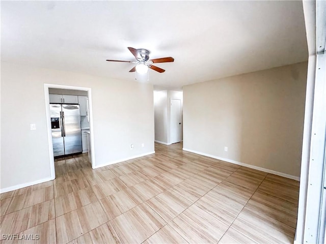 508 Wyoming Rd, Lehigh Acres, FL 33936 - empty room featuring a ceiling fan and baseboards