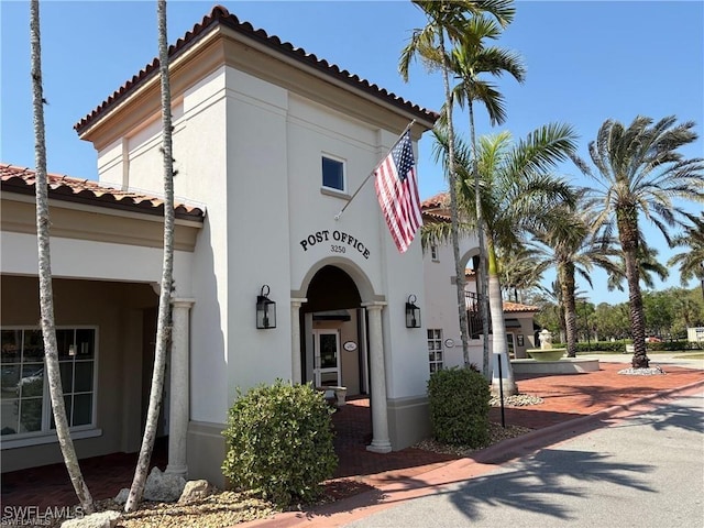 4788 San Carlo Ct, Naples, FL 34109 - view of front of property featuring a tile roof and stucco siding