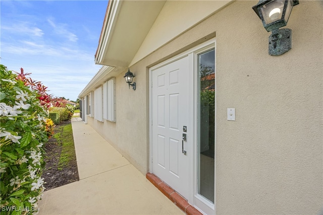 4788 San Carlo Ct, Naples, FL 34109 - entrance to property with stucco siding