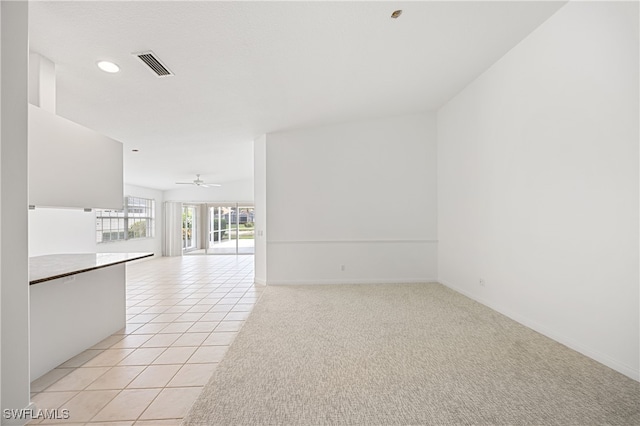 4788 San Carlo Ct, Naples, FL 34109 - unfurnished living room featuring light tile patterned flooring and ceiling fan
