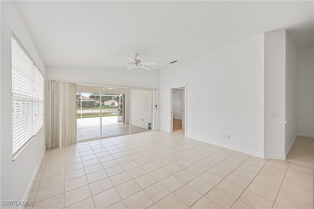 4788 San Carlo Ct, Naples, FL 34109 - spare room featuring ceiling fan, light tile patterned flooring, and lofted ceiling