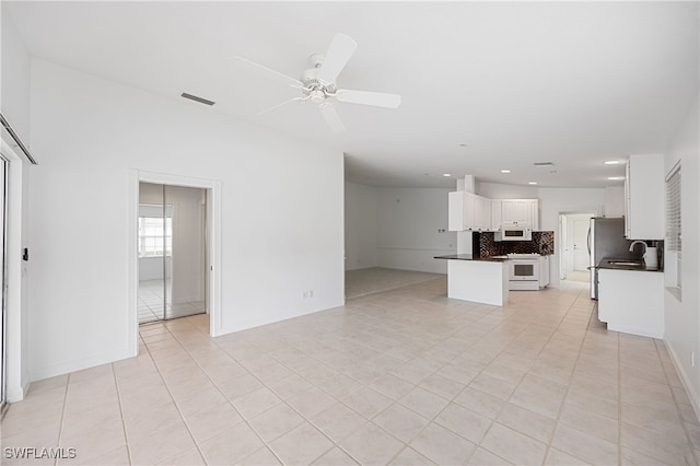 4788 San Carlo Ct, Naples, FL 34109 - unfurnished living room with light tile patterned flooring, a ceiling fan, and recessed lighting