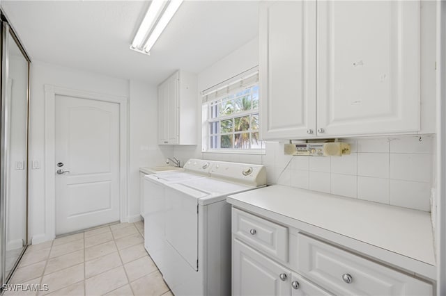 4788 San Carlo Ct, Naples, FL 34109 - laundry room with cabinet space, independent washer and dryer, and light tile patterned floors
