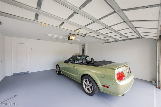 4788 San Carlo Ct, Naples, FL 34109 - garage featuring a garage door opener