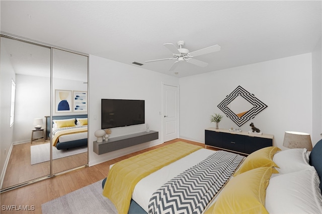 4788 San Carlo Ct, Naples, FL 34109 - bedroom with wood finished floors and ceiling fan