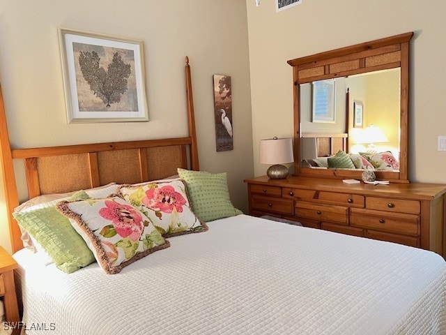 bedroom featuring visible vents