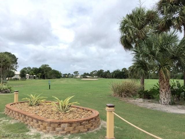 view of home's community featuring a yard