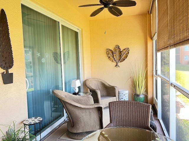 exterior space featuring ceiling fan