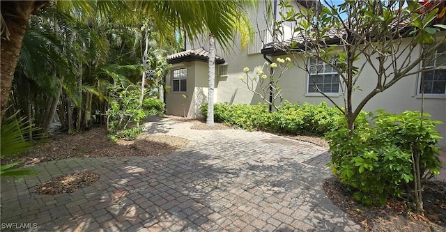 3787 Whippoorwill Ct, Punta Gorda, FL 33950 - view of front of home with a patio area and stucco siding