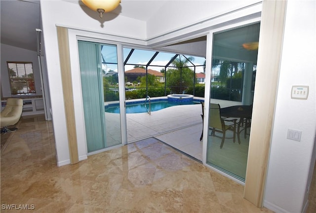 3787 Whippoorwill Ct, Punta Gorda, FL 33950 - doorway to outside with a sunroom, baseboards, and lofted ceiling