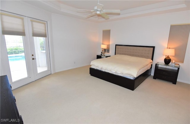 3787 Whippoorwill Ct, Punta Gorda, FL 33950 - bedroom with crown molding, a tray ceiling, carpet flooring, and access to exterior