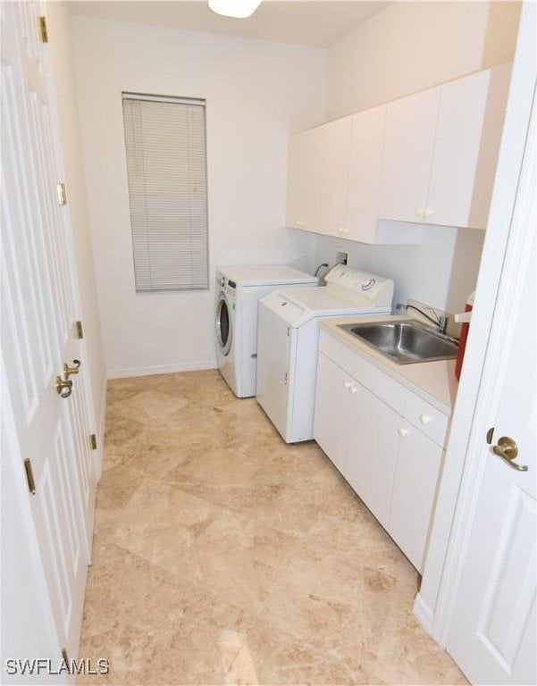 3787 Whippoorwill Ct, Punta Gorda, FL 33950 - clothes washing area featuring cabinet space, separate washer and dryer, and a sink