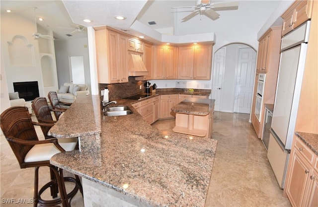 3787 Whippoorwill Ct, Punta Gorda, FL 33950 - kitchen featuring a ceiling fan, light brown cabinetry, and black electric stovetop