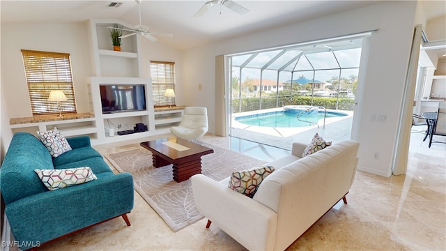 3787 Whippoorwill Ct, Punta Gorda, FL 33950 - living room featuring visible vents, lofted ceiling, ceiling fan, a sunroom, and built in shelves
