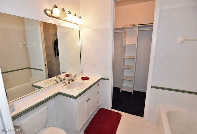 3787 Whippoorwill Ct, Punta Gorda, FL 33950 - full bath with vanity, tile patterned floors, a spacious closet, and toilet