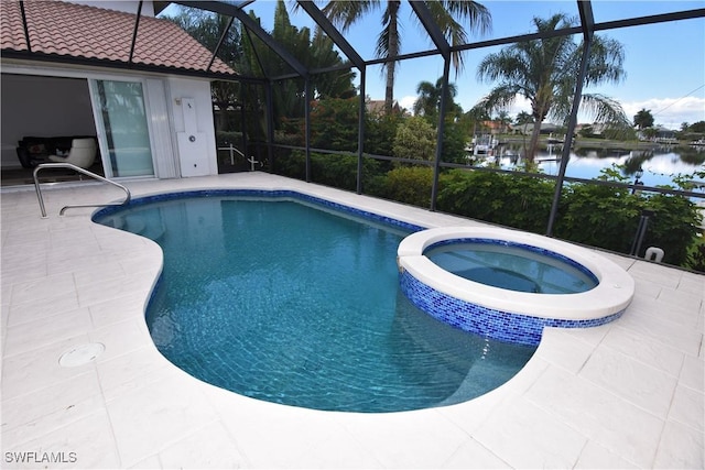 3787 Whippoorwill Ct, Punta Gorda, FL 33950 - view of pool with a lanai, a patio area, a pool with connected hot tub, and a water view