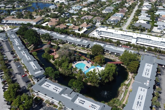 600 Neapolitan Way Unit 345, Naples, FL 34103 - view of property location featuring a pool area, nearby suburban area, and a large body of water