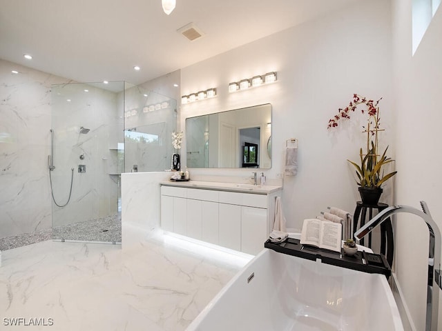 bathroom featuring recessed lighting, a freestanding tub, and a marble finish shower