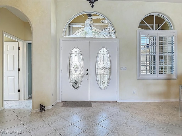 20710 Mystic Way N, Fort Myers, FL 33917 - foyer entrance with arched walkways and baseboards