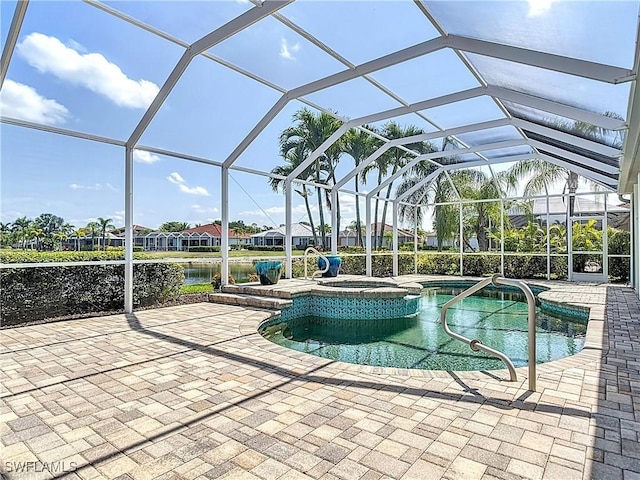 20710 Mystic Way N, Fort Myers, FL 33917 - view of pool with a patio, a pool with connected hot tub, and a water view