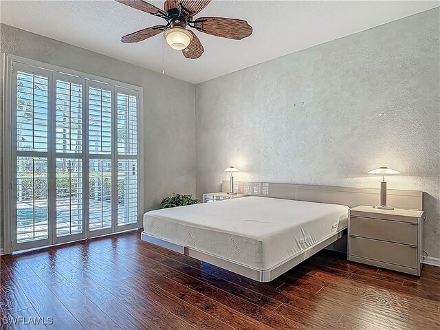 20710 Mystic Way N, Fort Myers, FL 33917 - bedroom with a textured wall, wood finished floors, and ceiling fan