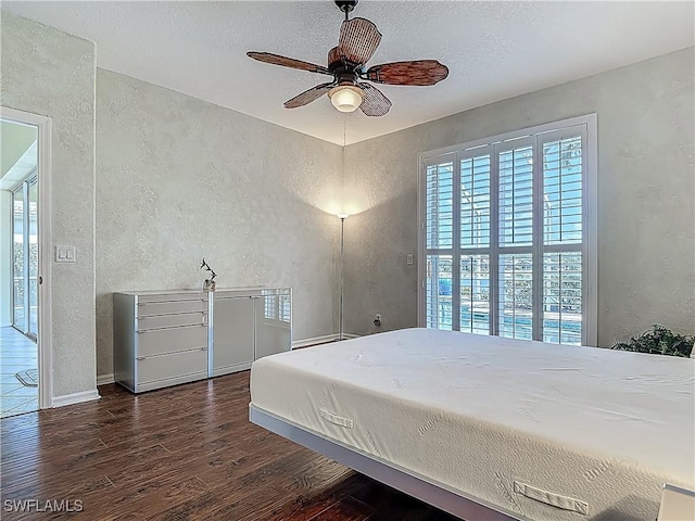 20710 Mystic Way N, Fort Myers, FL 33917 - bedroom featuring a textured wall, wood finished floors, and a textured ceiling