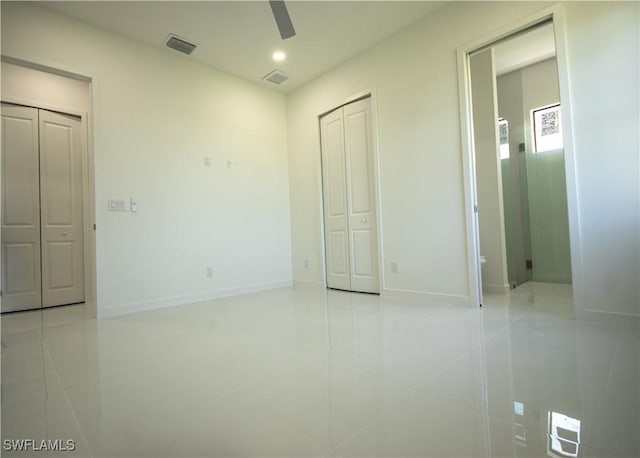 3610 22nd St SW, Lehigh Acres, FL 33976 - unfurnished bedroom with visible vents, recessed lighting, baseboards, and light tile patterned flooring