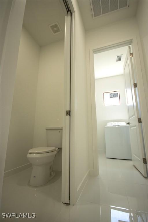 3610 22nd St SW, Lehigh Acres, FL 33976 - bathroom with toilet, baseboards, visible vents, and tile patterned floors