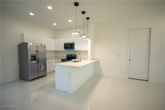 3610 22nd St SW, Lehigh Acres, FL 33976 - kitchen featuring white cabinets, appliances with stainless steel finishes, a sink, a peninsula, and recessed lighting
