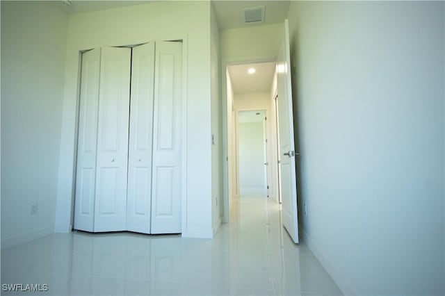 3610 22nd St SW, Lehigh Acres, FL 33976 - interior space with visible vents, baseboards, light tile patterned floors, and a closet