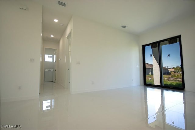 3610 22nd St SW, Lehigh Acres, FL 33976 - tiled spare room featuring washer / clothes dryer, recessed lighting, baseboards, and visible vents