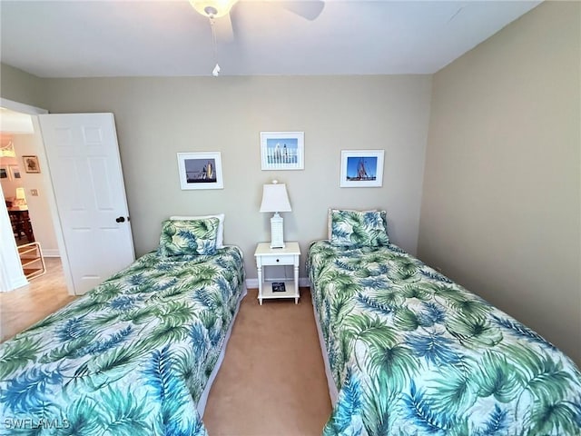 bedroom with carpet floors, ceiling fan, and baseboards