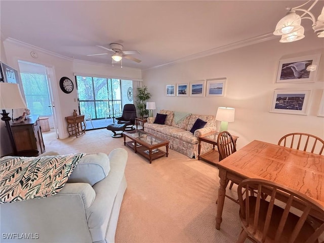 living room featuring ceiling fan, light carpet, and ornamental molding