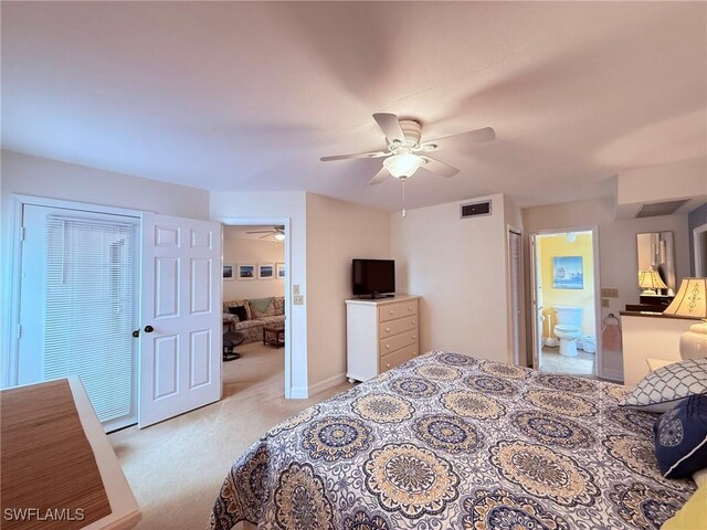 carpeted bedroom featuring connected bathroom, a ceiling fan, and visible vents