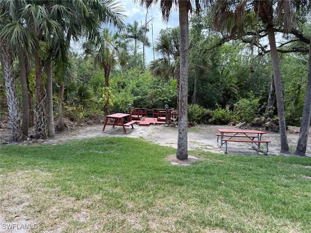 view of home's community featuring a lawn