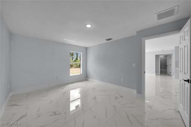 755 Milano Ave S, Lehigh Acres, FL 33974 - empty room featuring recessed lighting, baseboards, marble finish floor, and visible vents
