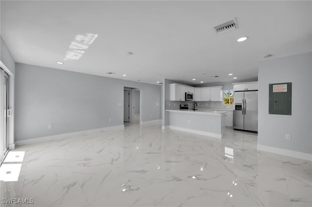 755 Milano Ave S, Lehigh Acres, FL 33974 - unfurnished living room with visible vents, a sink, baseboards, marble finish floor, and recessed lighting