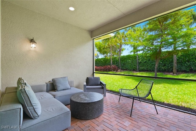sunroom / solarium featuring an outdoor hangout area