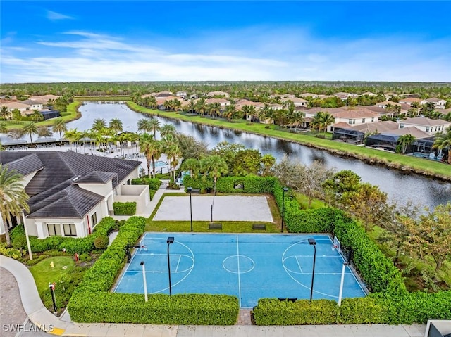 birds eye view of property with a residential view and a water view