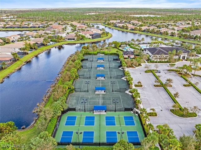 birds eye view of property with a water view and a residential view