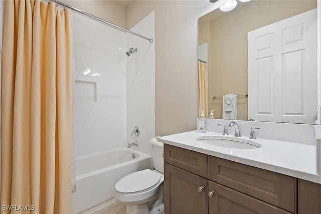 full bathroom featuring vanity, shower / tub combo with curtain, and toilet