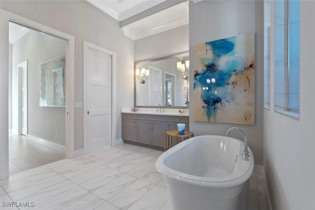 6250 Lightbourn Way, Naples, FL 34113 - full bathroom featuring a notable chandelier, a freestanding bath, vanity, marble finish floor, and baseboards