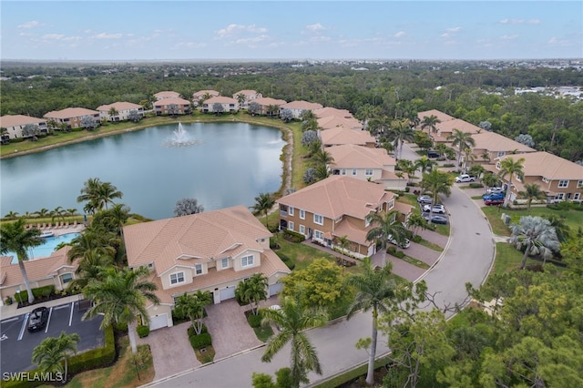bird's eye view featuring a residential view and a water view