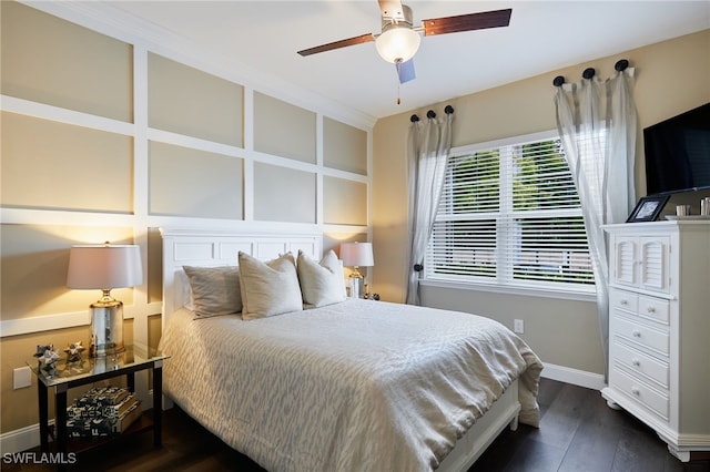 bedroom featuring baseboards, a ceiling fan, and dark wood-style floors