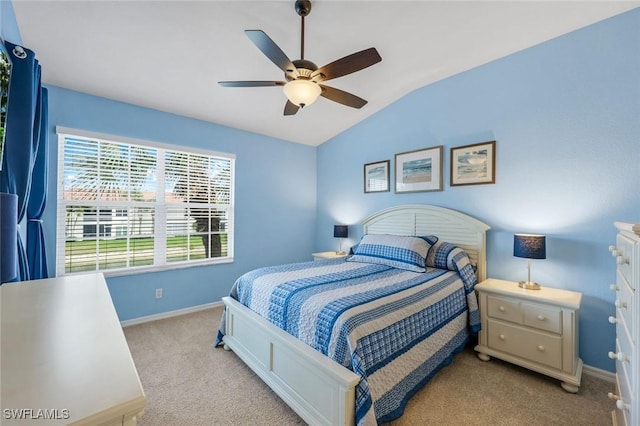 bedroom with light colored carpet, baseboards, ceiling fan, and lofted ceiling